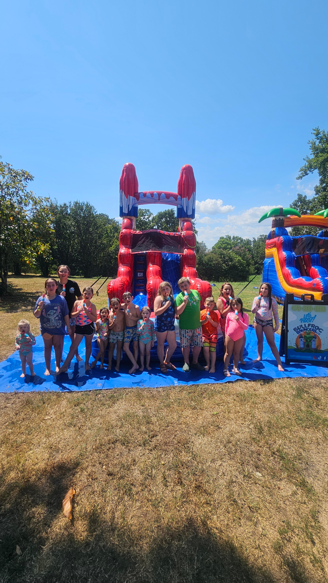Group enjoying water slide rental in Bentonville Arkansas